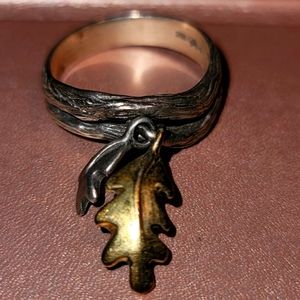 Silver ring with dangling leaves